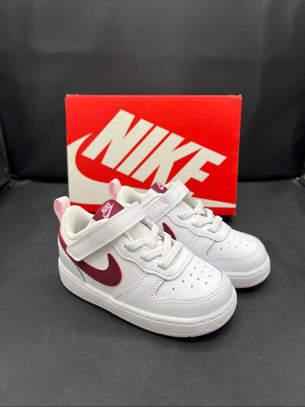 Nike Kids White Sneakers with Burgundy Swoosh and Pink Accents